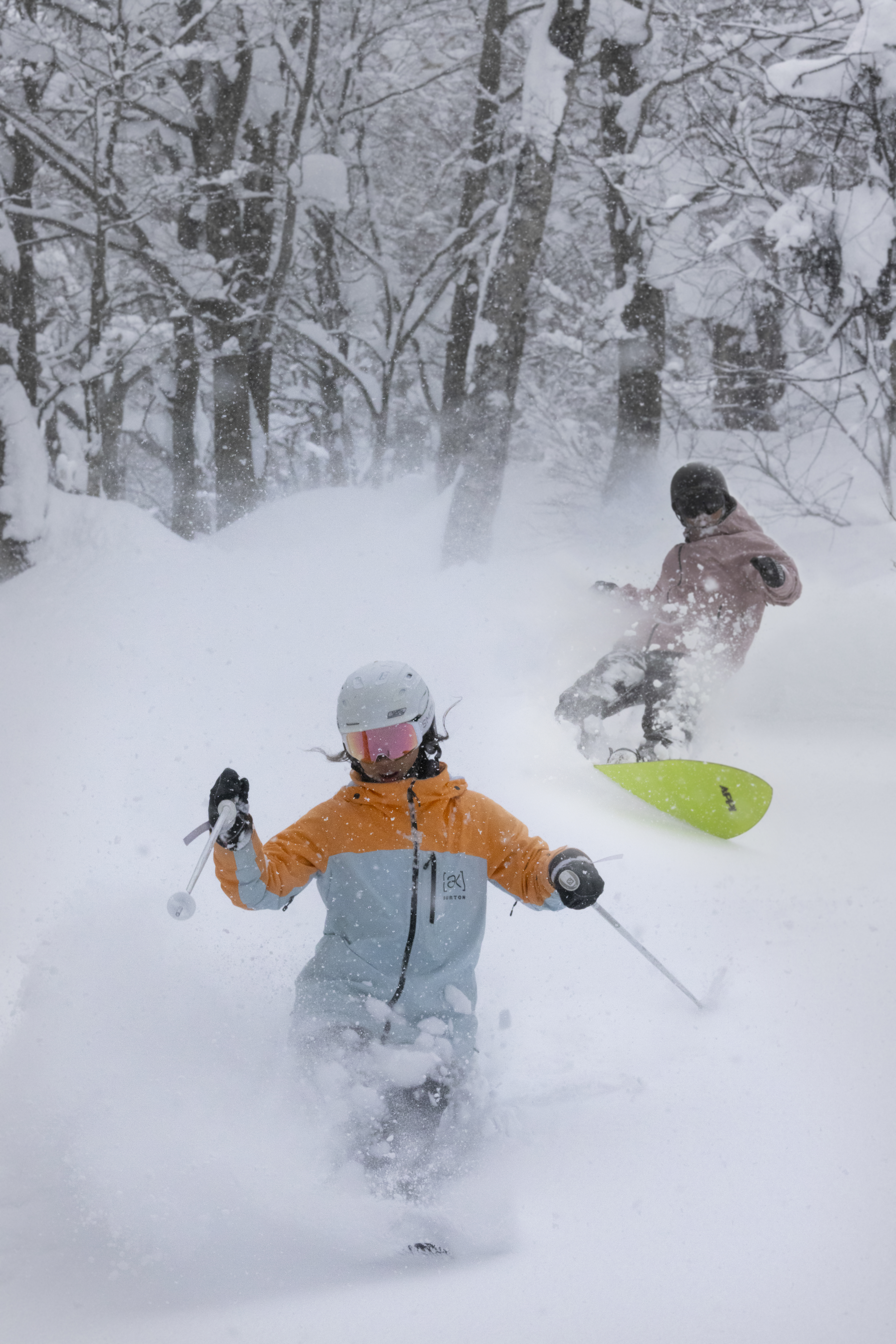 Skiers on the wide, groomed slopes of Appi Kogen with mountain views